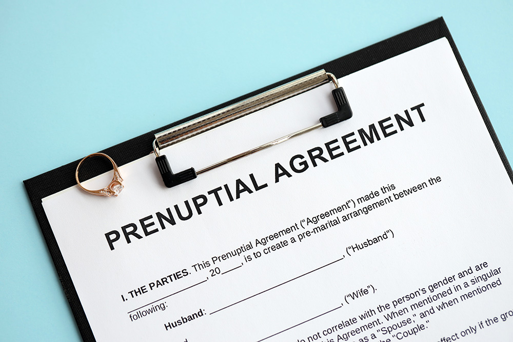 prenuptial-agreement-and-wedding-ring-on-table-pr-2026-01-08-23-49-46-utc